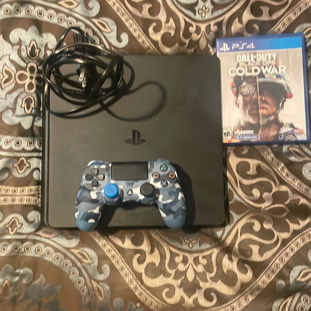 PlayStation 4 including cord, controller, and call of duty black ops Cold War